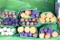 Group of waternut, chinese water chestnut, purple and yeloow sweet potato in banana leaf plate in the fresh market