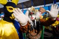 A group wearing traditional Venetian carnival costumes are seen