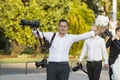 A group of wedding photographers on the streets of Budapest is holding a photo session for a couple of newlyweds. Royalty Free Stock Photo