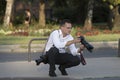 A group of wedding photographers on the streets of Budapest is holding a photo session for a couple of newlyweds. Royalty Free Stock Photo