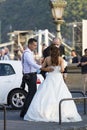 A group of wedding photographers on the streets of Budapest is holding a photo session for a couple of newlyweds. Royalty Free Stock Photo