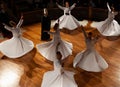 Group of Whirling Dervish | Semazen performing Sama ritual on stage Royalty Free Stock Photo