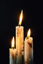 Group of white candles burning in the dark Royalty Free Stock Photo