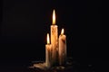 Group of white candles burning in the dark Royalty Free Stock Photo