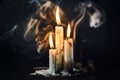 Group of white candles burning in the dark Royalty Free Stock Photo