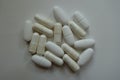 Group of capsules of magnesium citrate and caplets of calcium citrate Royalty Free Stock Photo