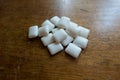 Group of chewing gum cushions on wooden table Royalty Free Stock Photo