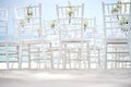 A group of white chiavari chairs on the beach wedding preparation, cones of roses petals - back, low angle view