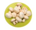 Group of white field mushroom on green plate. Royalty Free Stock Photo