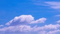 Group of white fluffy clouds floating on blue sky background, beautiful cloudscape view Royalty Free Stock Photo