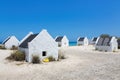 Group of white slave houses on bonairean beach Royalty Free Stock Photo