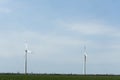 A group of wind farms to generate electricity on a beautiful bright day. Green electricity