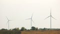 Group of wind power plants on agricultural fields. Royalty Free Stock Photo