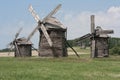 Group of windmills in National Museum of Folk Architecture and Life of Ukraine near Kiev Royalty Free Stock Photo