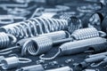 The group of wire coil spring parts in the light blue scene Royalty Free Stock Photo
