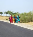 A Group of Woman walking at the Roadside of a Street to Pushkar, India Royalty Free Stock Photo