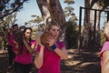 Group of women carrying a heavy wooden log during obstacle course Royalty Free Stock Photo