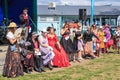 Row of women in vintage and steampunk outfits