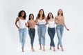 Group of women with different body types on background