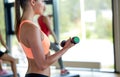 Group of women with dumbbells and steppers