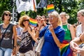 Group of women with flags participating in the LGBTQ pride march