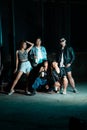 a group of women and men in modern clothes taking pictures together in a clubbing place while celebrating the new year a group of Royalty Free Stock Photo