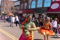 A group of women performing different kinds of dances on the street