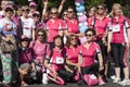 Group of women with pink shirts poses for a group photo