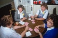 A group of women playing bridge