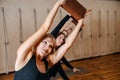 Group of women practicing yoga stretching using wooden blocks, exercise for spine and shoulders flexibility Royalty Free Stock Photo