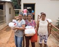 A group of women that received a basic food kit Royalty Free Stock Photo