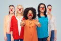 Group of women showing thumbs up at red nose day Royalty Free Stock Photo