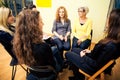 Group Of Women Sitting In A Circle, Discussing