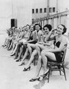 Group of women sitting together on chairs