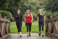 Group women in their 30s walking together in the outdoors. Royalty Free Stock Photo