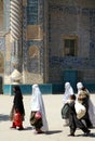 A group of women walk past the Shrine of Khwaja Abu Nasr Parsa or Green Mosque in Balkh, Afghanistan Royalty Free Stock Photo