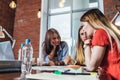 Group of women working sitting at desk in office