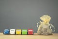 Group of a wood toy car with a coin in a gold bag Royalty Free Stock Photo