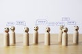 Group of wooden figure with comment message box cloud for customer feedback or group discussion for problem solving concept Royalty Free Stock Photo