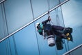 Group of workers cleaning windows service on high rise building Royalty Free Stock Photo