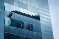 Group of workers cleaning windows service on high rise building Royalty Free Stock Photo