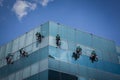 Group of workers cleaning windows service on high rise building Royalty Free Stock Photo