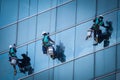 Group of workers cleaning windows service on high rise building Royalty Free Stock Photo