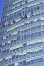 group of workers cleaning windows service on high rise building Royalty Free Stock Photo