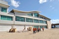 Group of workers, architects and builders entering a construction.