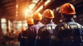 Group of workers in hardhats and reflective safety vests are seen from the back, standing together. AI generated Royalty Free Stock Photo