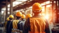 Group of workers in hardhats and reflective safety vests are seen from the back, standing together. AI generated Royalty Free Stock Photo