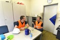 Group of workers in an industrial company take a coffee break