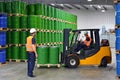group of workers in the logistics industry work in a warehouse with chemicals Royalty Free Stock Photo