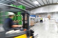 Group of workers in the logistics industry work in a warehouse w